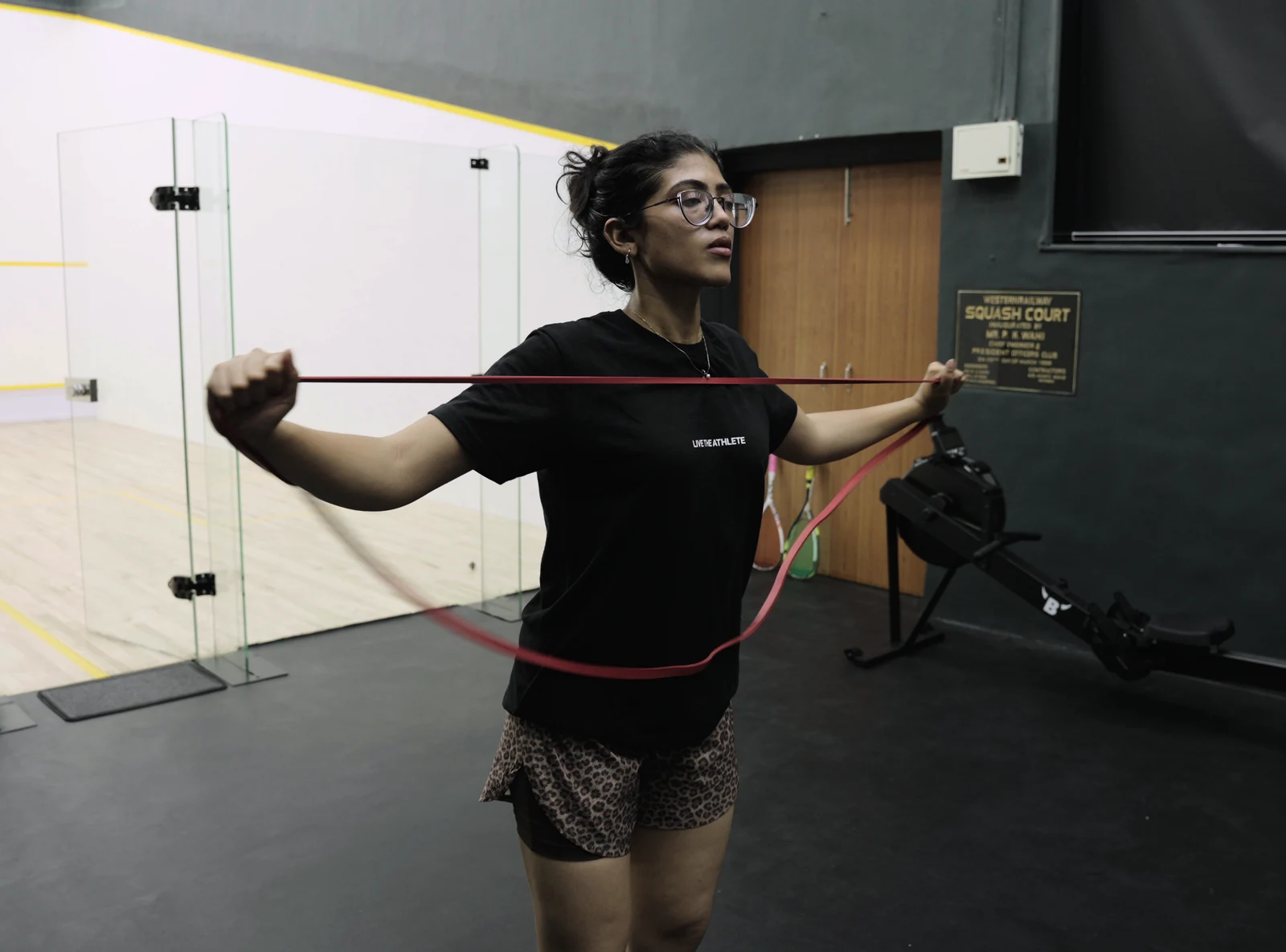An athlete performing a resistance-band exercise in the BAY training area.